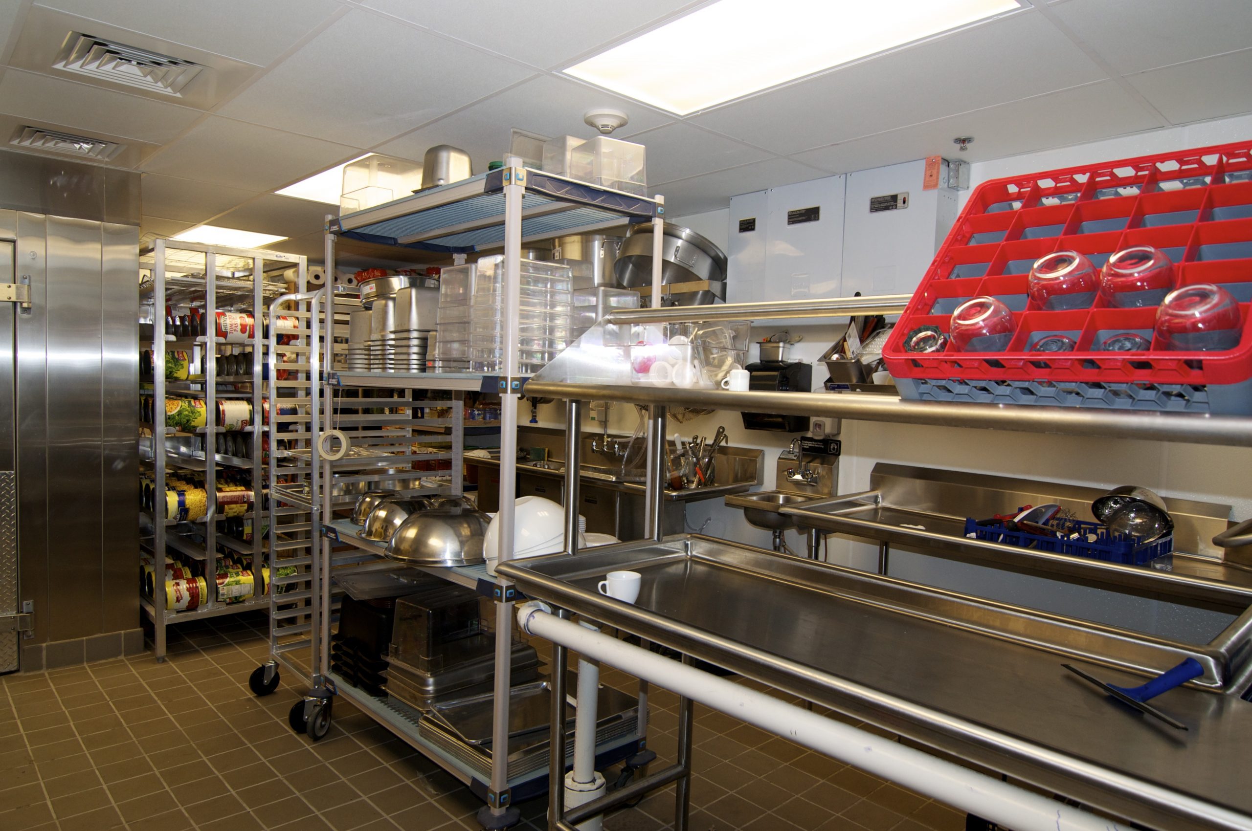 Commercial restaurant kitchen with equipment in dishwasher area