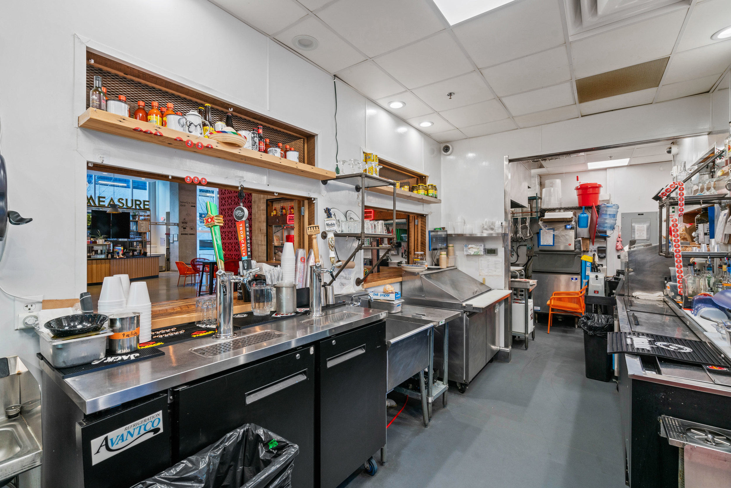 Bar area for an Atlanta Food Hall located in Midtown Atlanta with bar and liquor bottles.