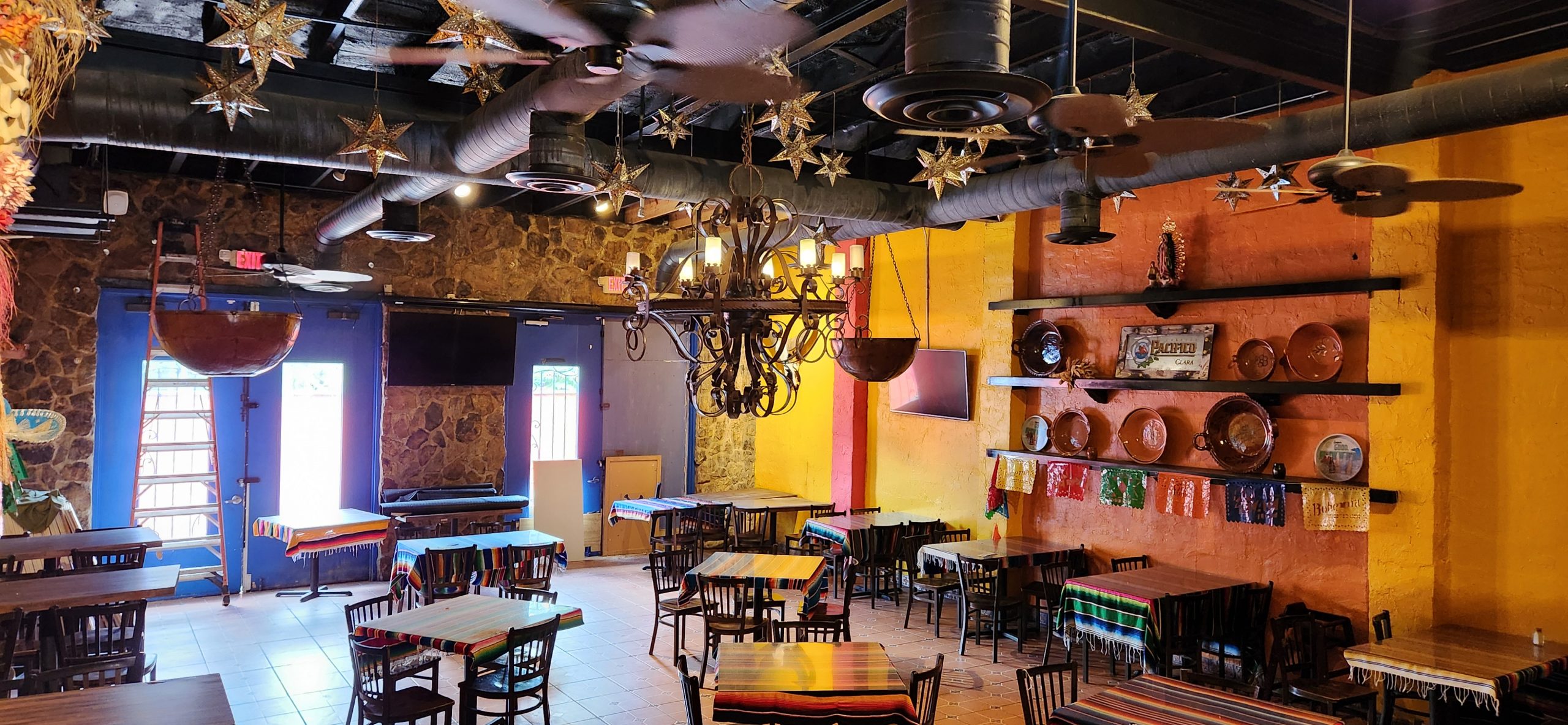 Mexican restaurant with chandelier and bright earth tone colors listed by Jimmy Carey Commercial Real Estate