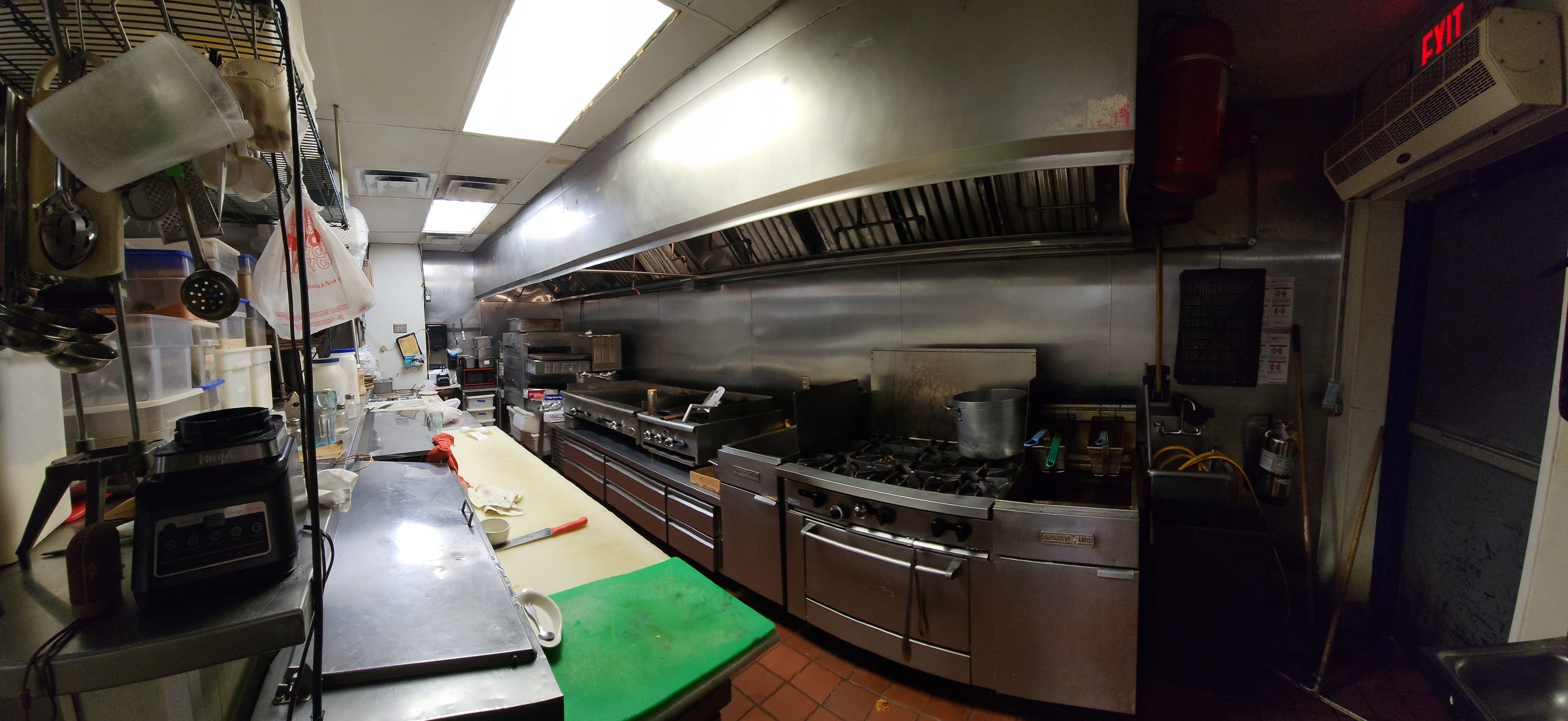 Commercial mexican restaurant kitchen with commercial kitchen equipment and 20 foot hood listed by Jimmy Carey Commercial Real Estate