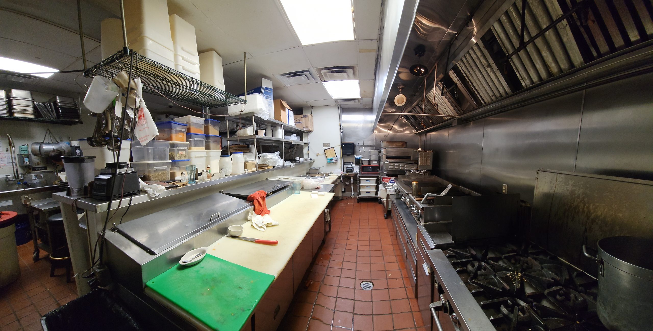 Commercial restaurant kitchen with 20 foot hood and commercial kitchen equipment listed by Jimmy Carey Commercial Real Estate in Atlanta