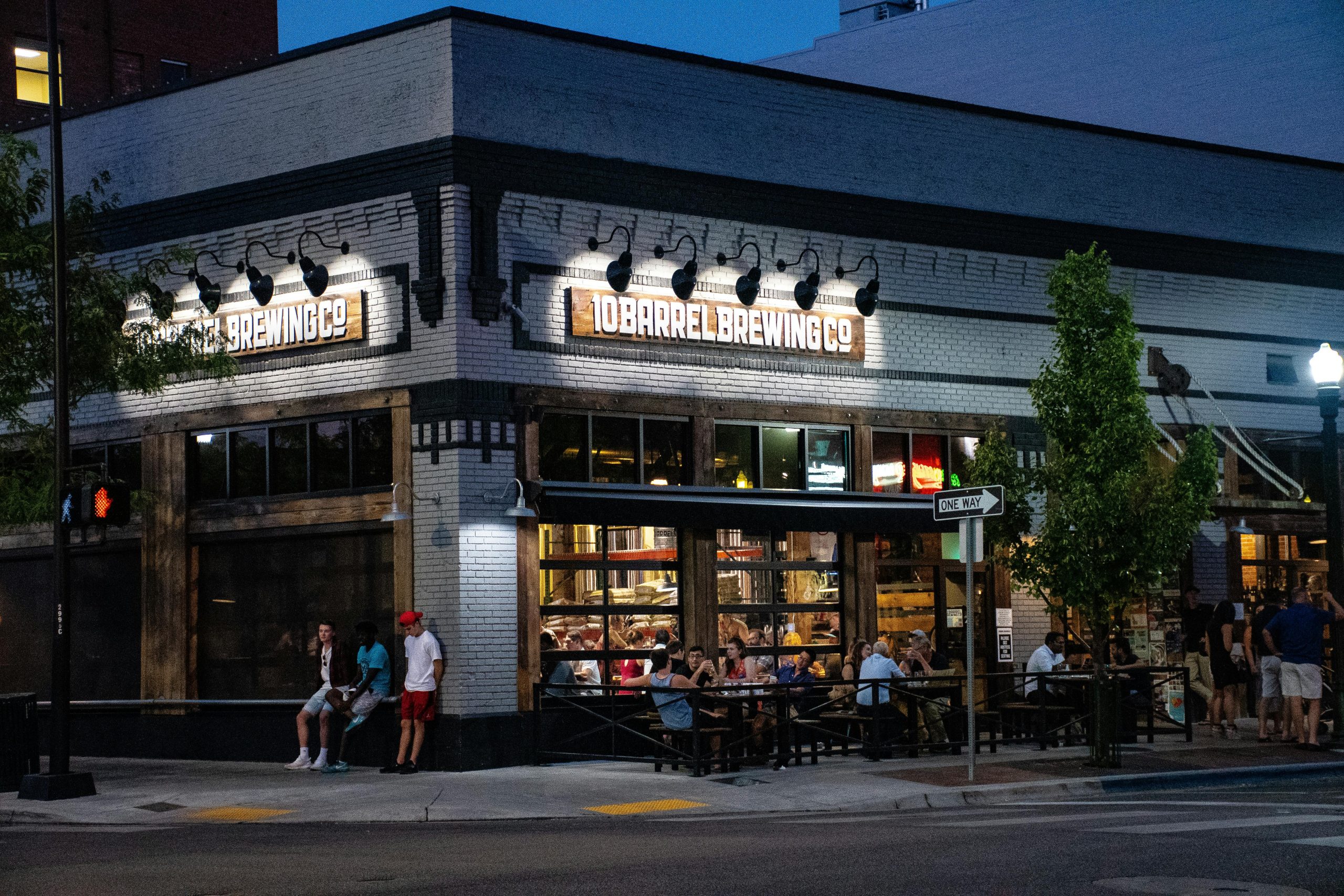 Modern restaurant with large pull up garage windows looking out to outdoor seating area Jimmy Carey Commercial Real Estate.