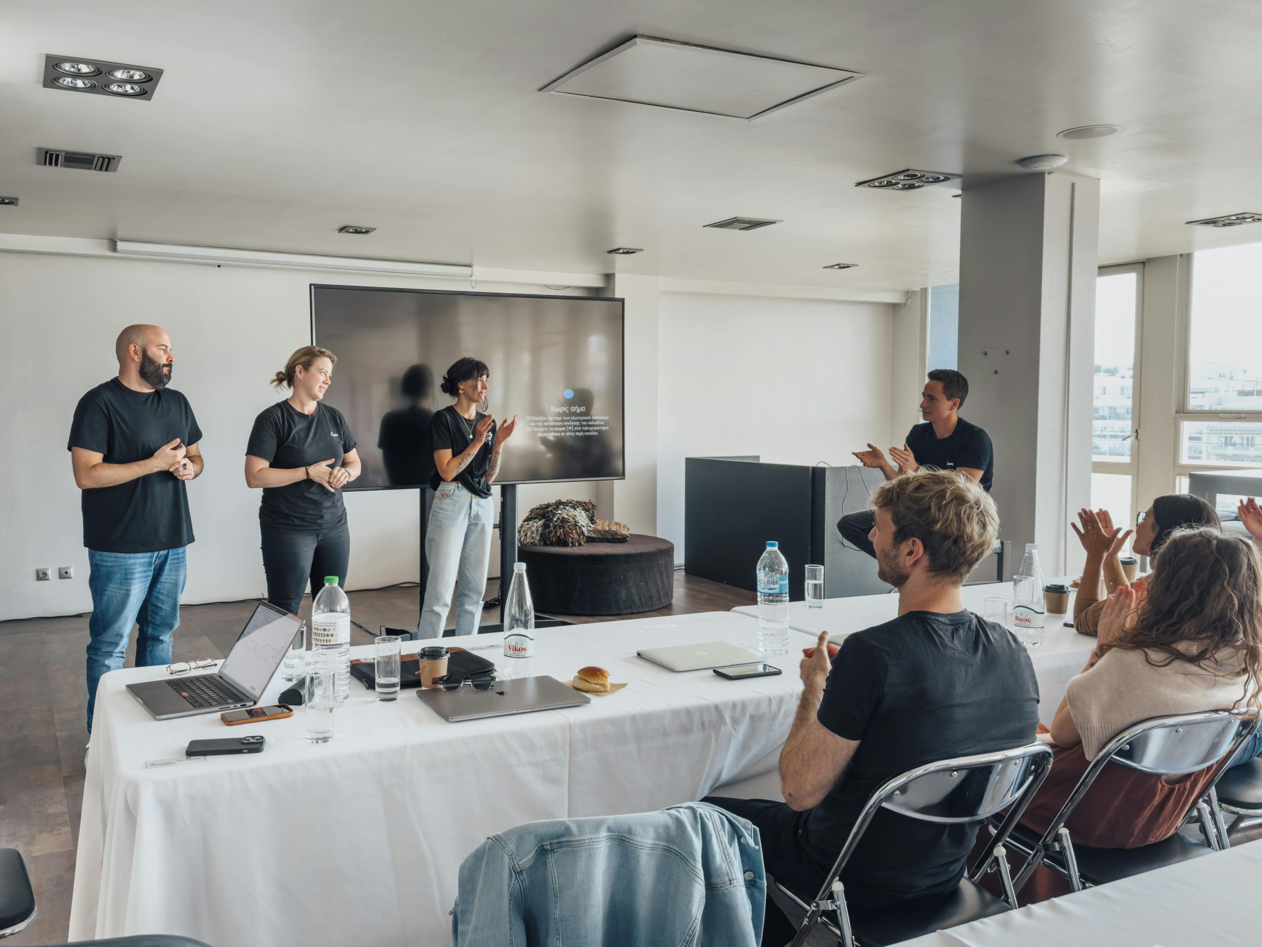 Interactive employee training class for restaurants with people talking with each other and role playing in front of their peers 