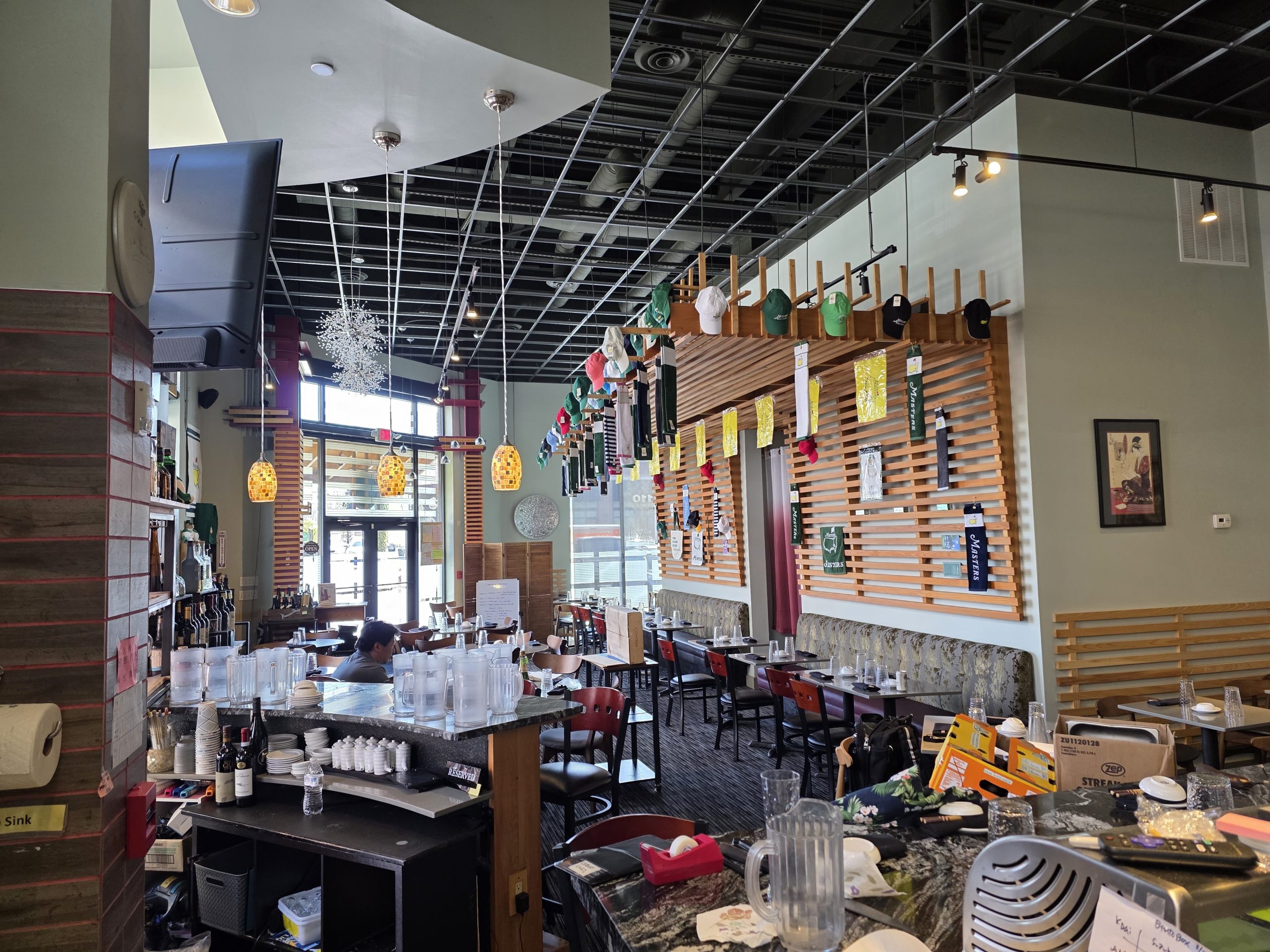Exterior of a sushi restaurant for sale, featuring glass windows, visible signage, and street-side view. Listed by Jimmy Carey Commercial Real Estate, Atlanta Restaurant Business Broker.