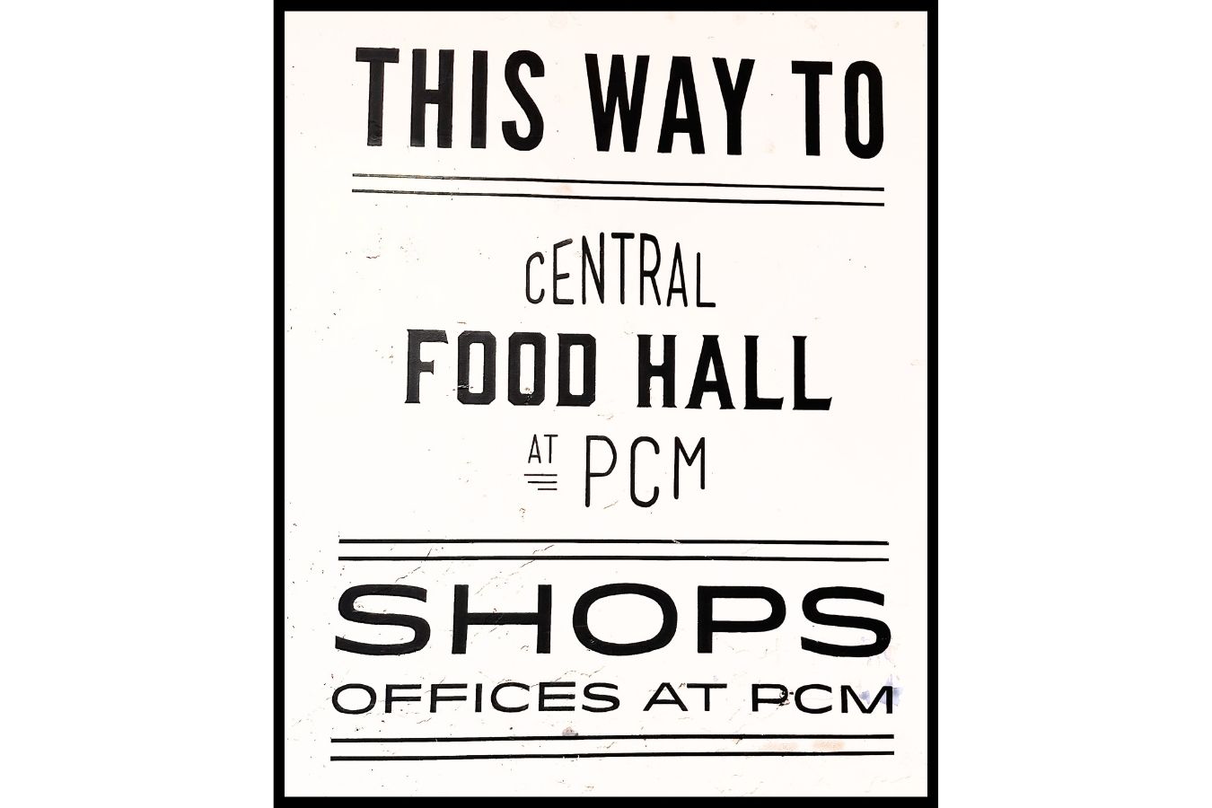 Directional sign to the Central Food Hall at Ponce City Market, highlighting shops and offices, captured by Jimmy Carey Commercial Real Estate – Atlanta Restaurant Business Broker.